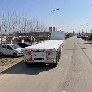 3 Axle Flatbed Semi Trailer 50 Ton Load Capacity Tri Axle Flatbed Truck for General Cargo and Container Transport