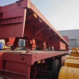Heavy Duty 40ft Tri Axle Steel Flatbed Semi Trailer with 80T Capacity for Multi Purpose Cargo and Container Transport